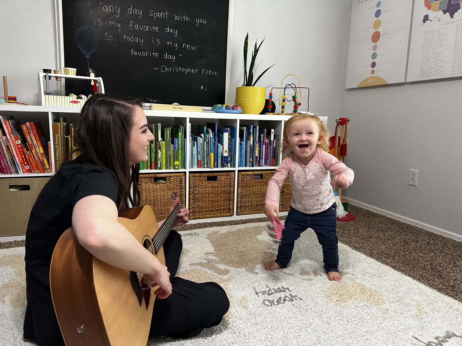 A child exploring a hand drum with a therapist during a music therapy session